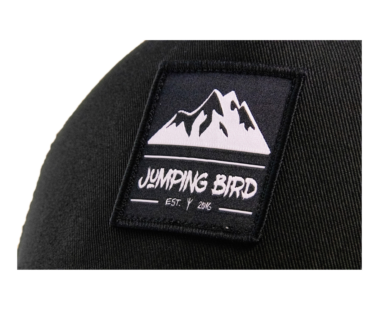 Trucker Cap von Jumping Bird - Modell Teufelsegg in schwarz mit elegantem Badge und Logo seitlich