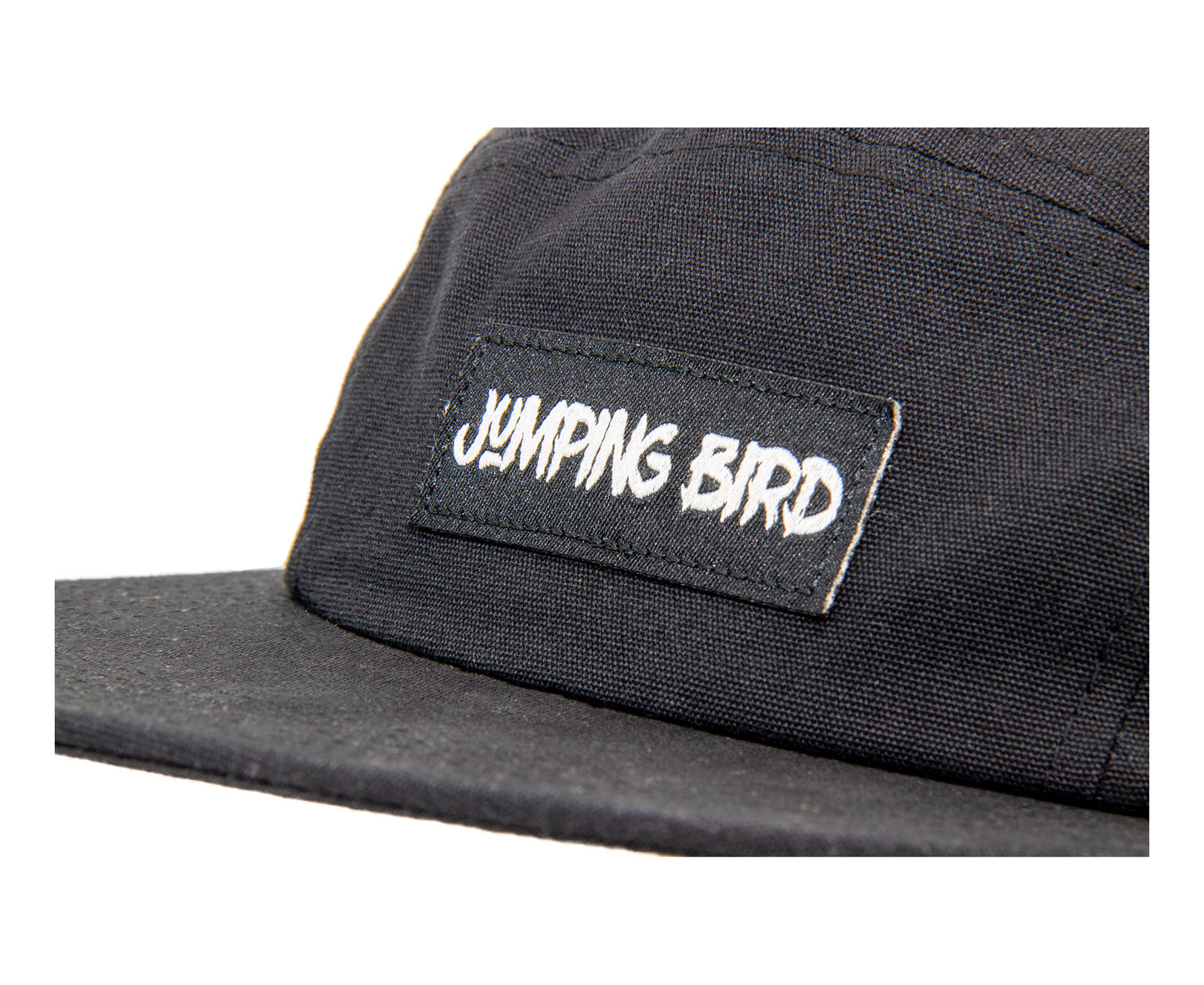 5-Panel-Cap von Jumping Bird in schwarz mit sportivem Frontpatch und weicher, unverstärkter Passform für hohen Tragekomfort