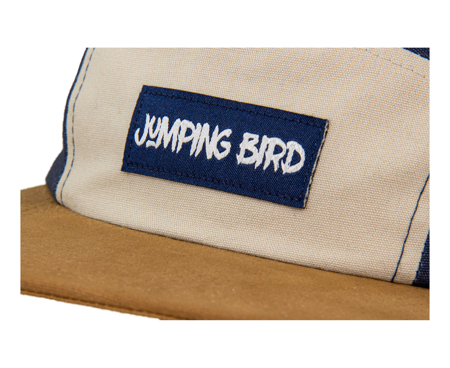5-Panel-Cap von Jumping Bird in Navy-Beige mit sportivem Frontpatch und weicher, unverstärkter Passform für hohen Tragekomfort