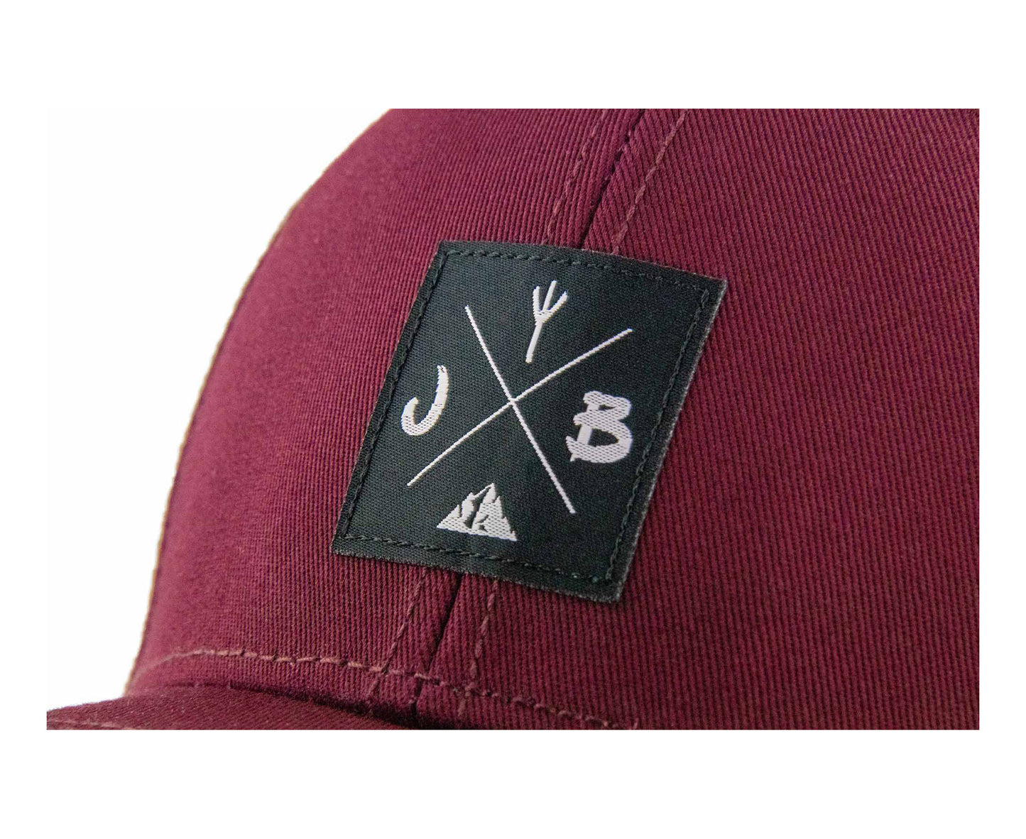 Baseball-Cap von Jumping Bird in Bordeaux mit sportivem Frontpatch und seitlichem Logostick