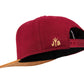 Filz-Snapback von Jumping Bird in Dunkelrot-Braun mit geprägtem Lederoptik-Patch vorn und seitlichem Logostick
