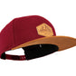 Filz-Snapback von Jumping Bird in Dunkelrot-Braun mit geprägtem Lederoptik-Patch vorn und seitlichem Logostick