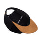Snapback-Cap von Jumping Bird in Schwarz-Braun mit geprägtem Lederoptik-Patch vorn und seitlichem Logostick