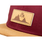Snapback-Cap von Jumping Bird in Bordeaux-Braun mit geprägtem Lederoptik-Patch vorn und seitlichem Logostick