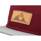 Snapback-Cap von Jumping Bird in Bordeaux-Grau mit geprägtem Lederoptik-Patch vorn und seitlichem Logostick