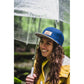 Snapback-Cap von Jumping Bird in Blau-Grau mit geprägtem Lederoptik-Patch vorn und seitlichem Logostick